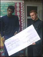 Daddy G and 3D with their cheque for £30,000